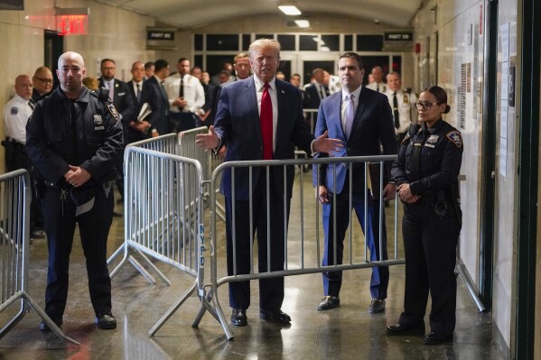 Former President Donald Trump speaks to reporters after leaving Manhattan criminal court, Thursday, Feb. 15, 2024, in New York. (AP Photo/Mary Altaffer)